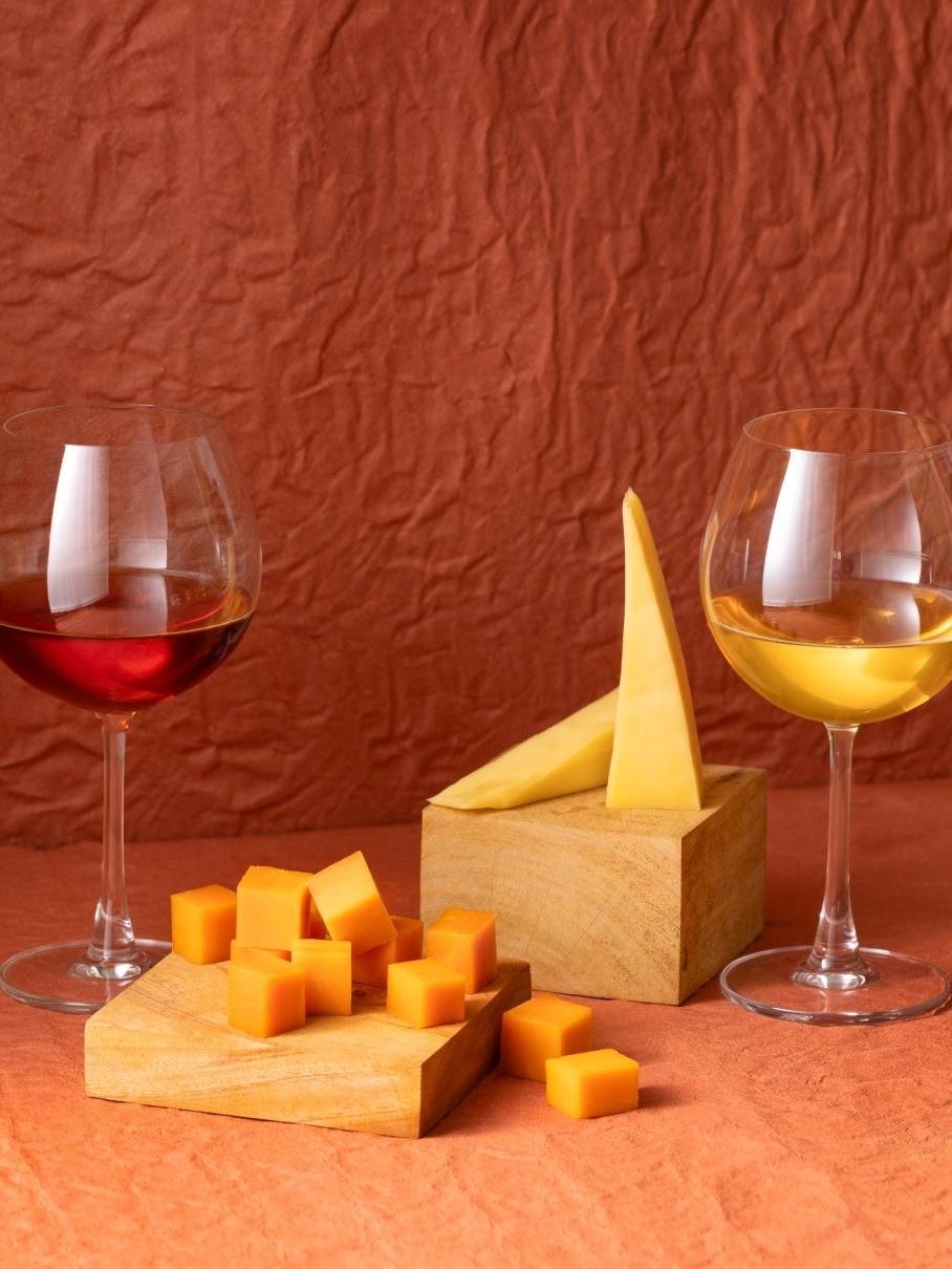 Artisanal cheeses plated alongside a pot of Thambapanni tea